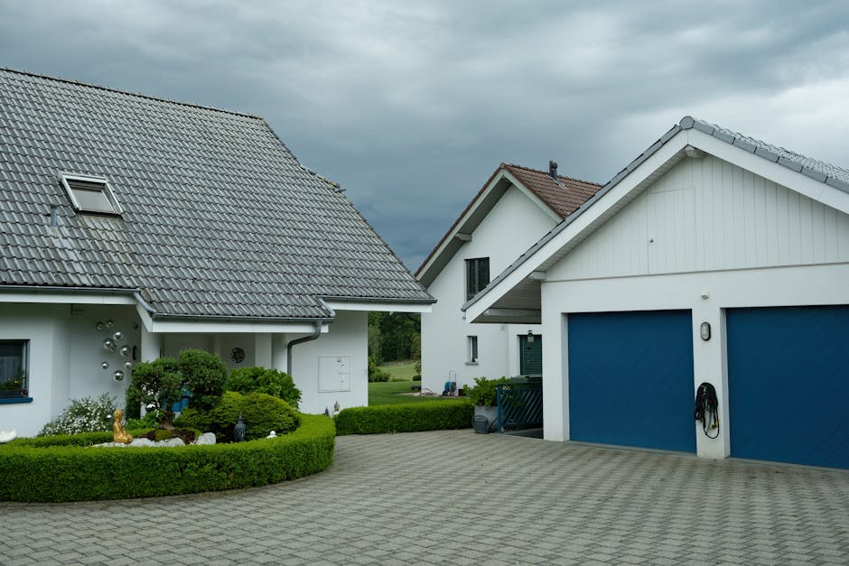 Adelaide residential garage with sectional door open at dusk